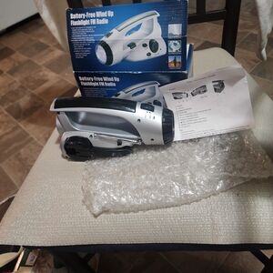 Brand Battery-Free Wind Up Flashlight FM Radio And It Works